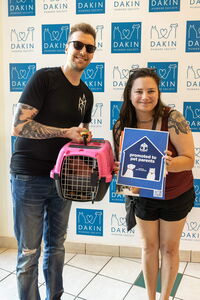 New adopters leaving Dakin with cat