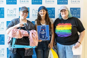 Three adopters prepare to leave Dakin with new cat