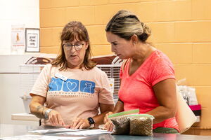 Adopter being helped at Dakin