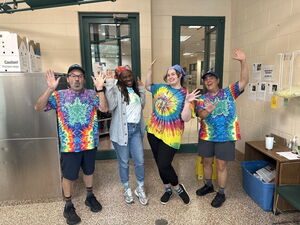 Dakin staff and volunteers in tie-dye outfits for Spirit Week