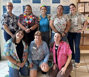 Dakin staff members in colorful Hawaiian shirts for Spirit Week