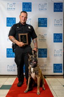 Police officer standing with K9 officer