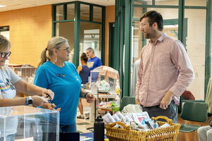 Staff helping adopter at Dakin