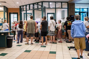 Adopters form a line to enter cat room at Dakin